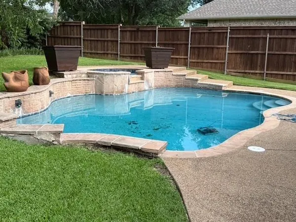 a view of a swimming pool with a lounge chairs