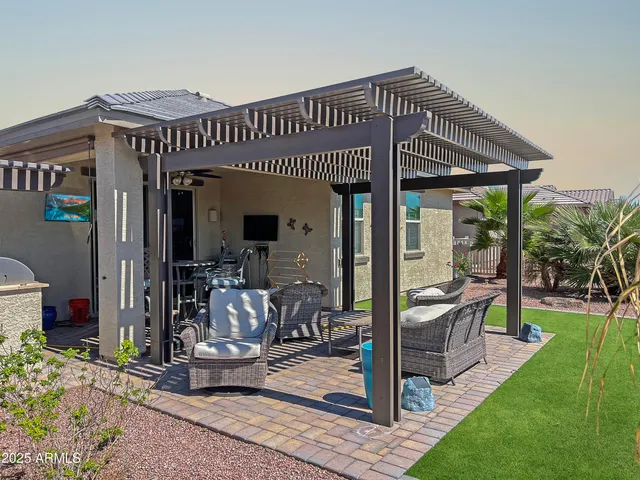 a view of a house with porch and furniture
