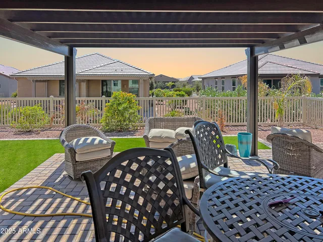 a view of a porch with furniture and yard