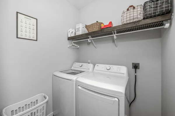 a balcony with table and chairs