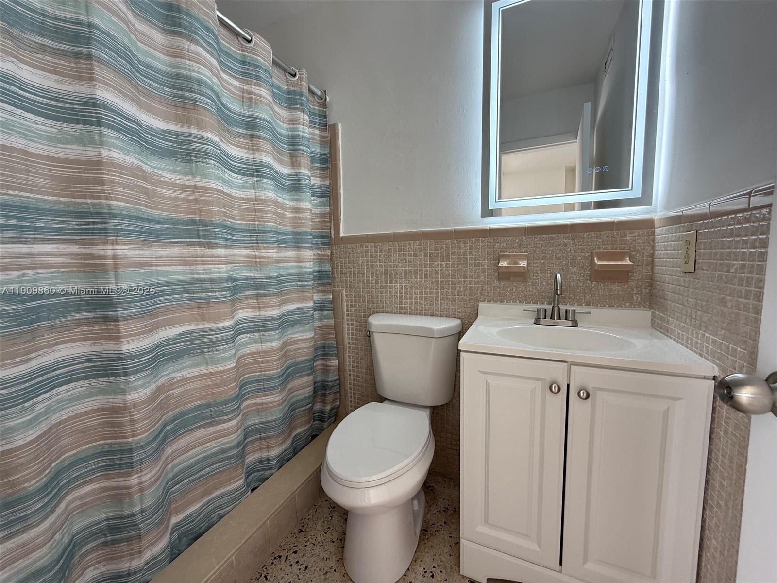 3200 Southwest 88th Place, Unit BACK Miami, FL 33165 - Photo 8 of 9 a bathroom with a sink and a toilet