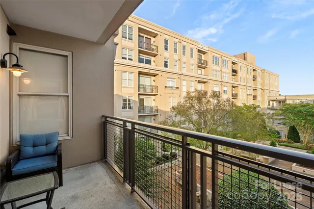 a view of balcony with furniture