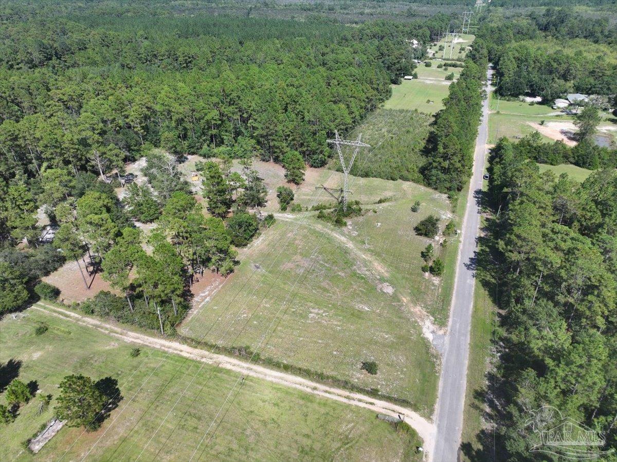 8330 Edith Avenue Milton, FL 32570 - Photo 13 of 19 an aerial view of a house with a yard and lake