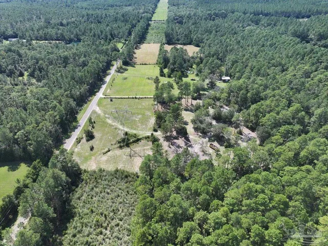an aerial view of residential house with outdoor space