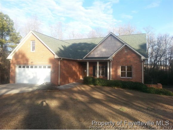 2341 Zacks Mill Road Angier, NC 27501 - Photo 1 of 25 a view of a house with a yard