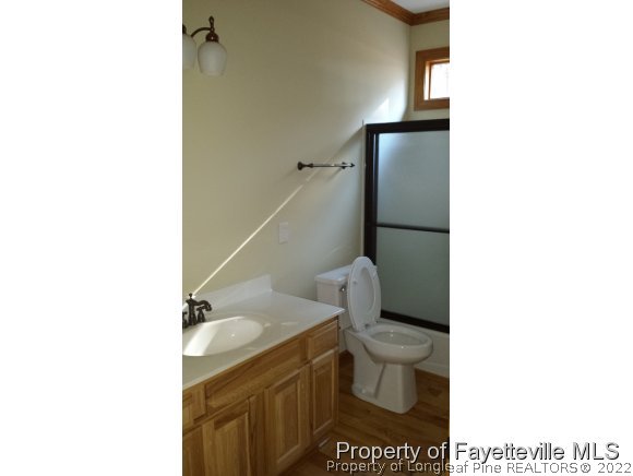 2341 Zacks Mill Road Angier, NC 27501 - Photo 12 of 25 a bathroom with a toilet and a sink