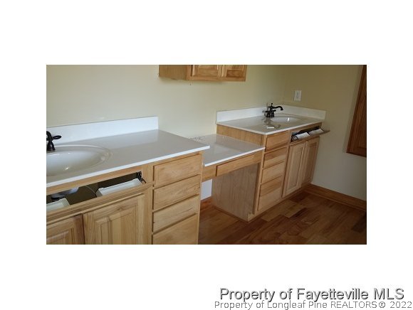 2341 Zacks Mill Road Angier, NC 27501 - Photo 14 of 25 a kitchen with a sink and cabinets