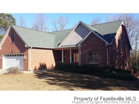 2341 Zacks Mill Road Angier, NC 27501 - Photo 19 of 25 a house view with a outdoor space