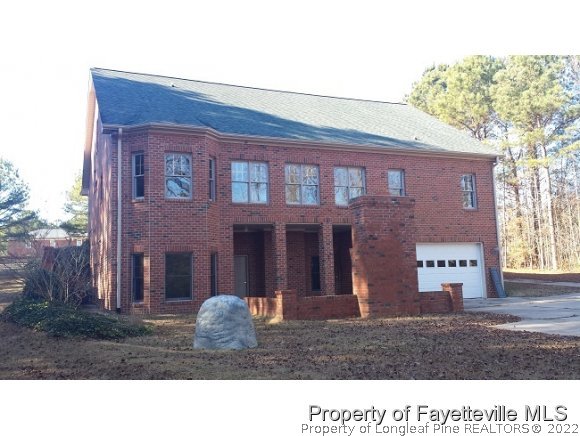 2341 Zacks Mill Road Angier, NC 27501 - Photo 4 of 25 a black and white photo of a house