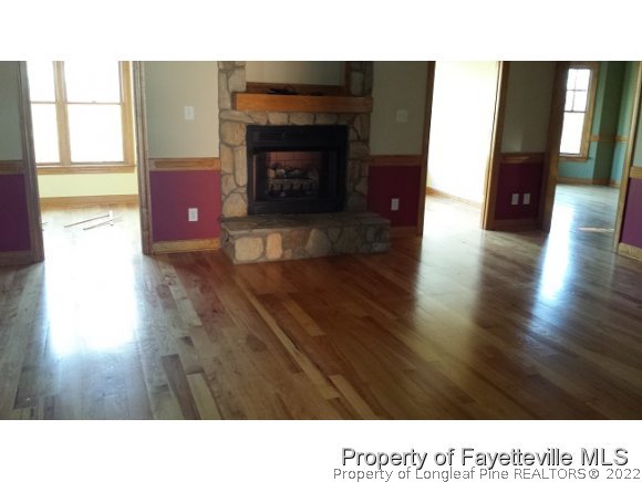 2341 Zacks Mill Road Angier, NC 27501 - Photo 7 of 25 a open kitchen with furniture and a fireplace