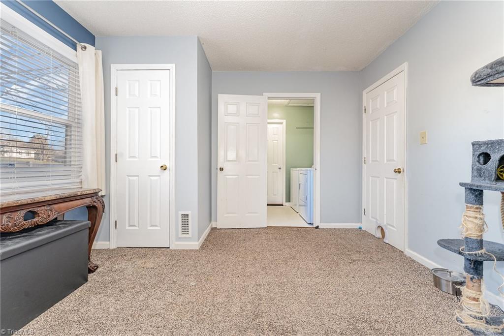 7113 North River Road Oak Ridge, NC 27310 - Photo 13 of 28 Bedroom connects to laundry room and full bath