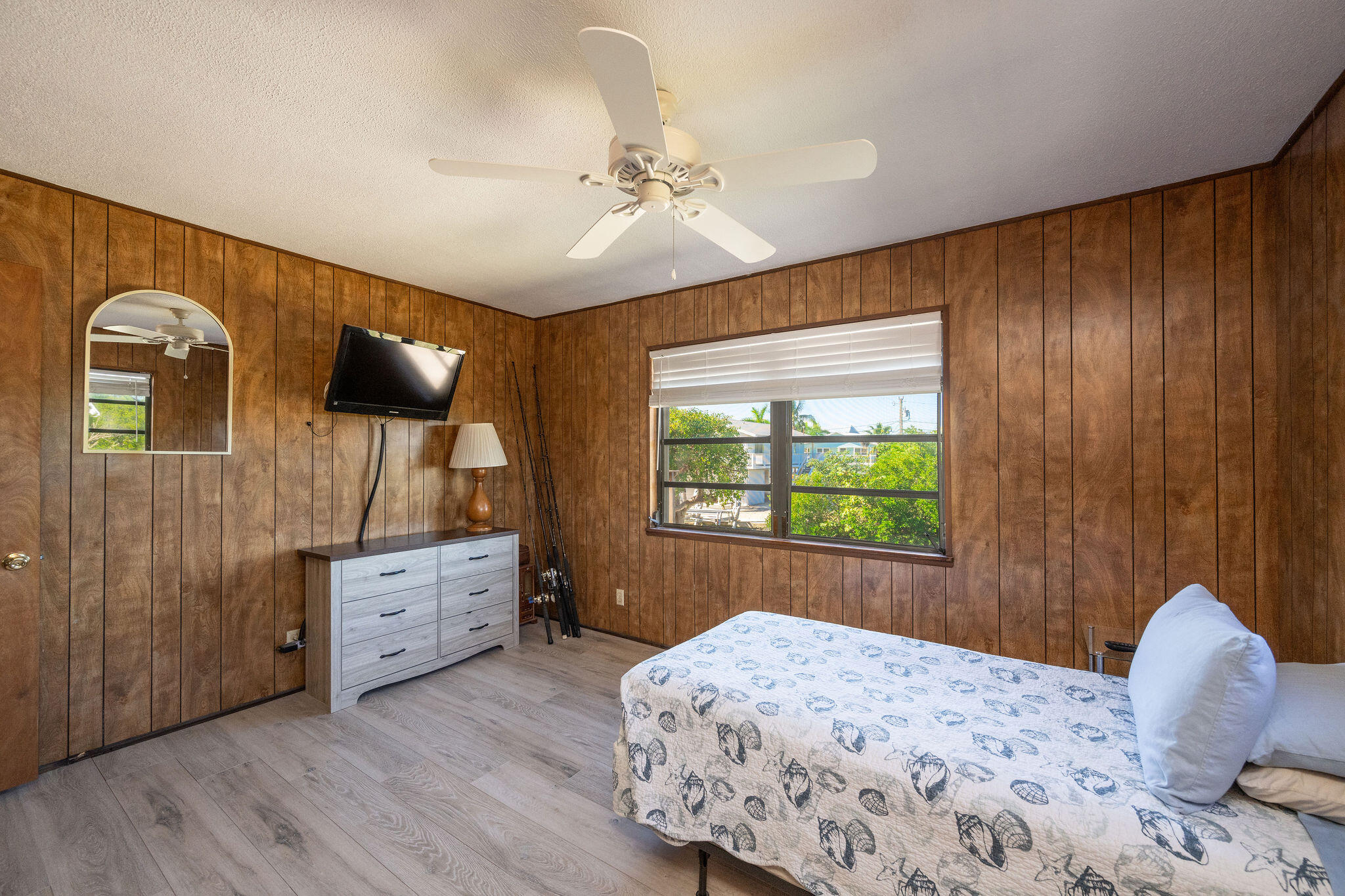 3856 Donna Road Big Pine Key, FL 33043 - Photo 11 of 28 a bedroom with a bed and a dresser