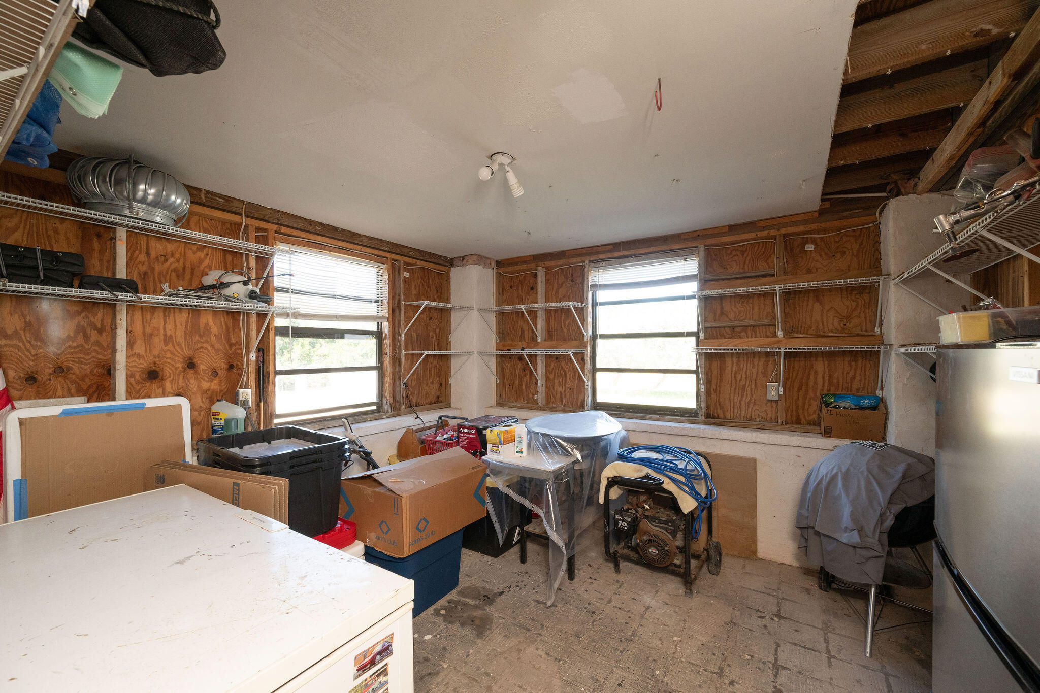 3856 Donna Road Big Pine Key, FL 33043 - Photo 19 of 28 a view of a workspace with furniture and a window