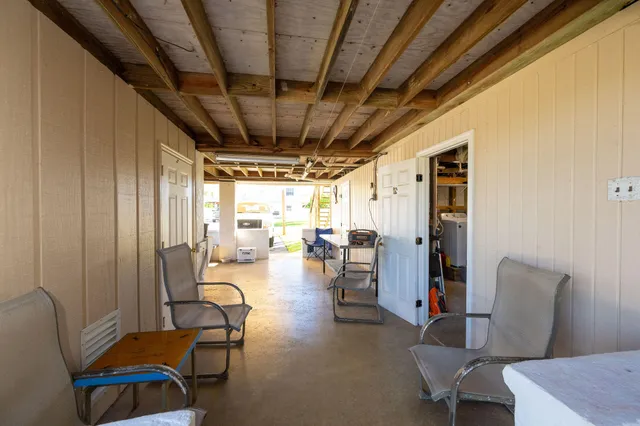 a view of a livingroom with furniture and a window