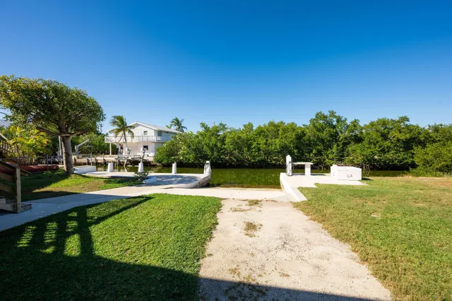 a view of a swimming pool with an outdoor space and seating area