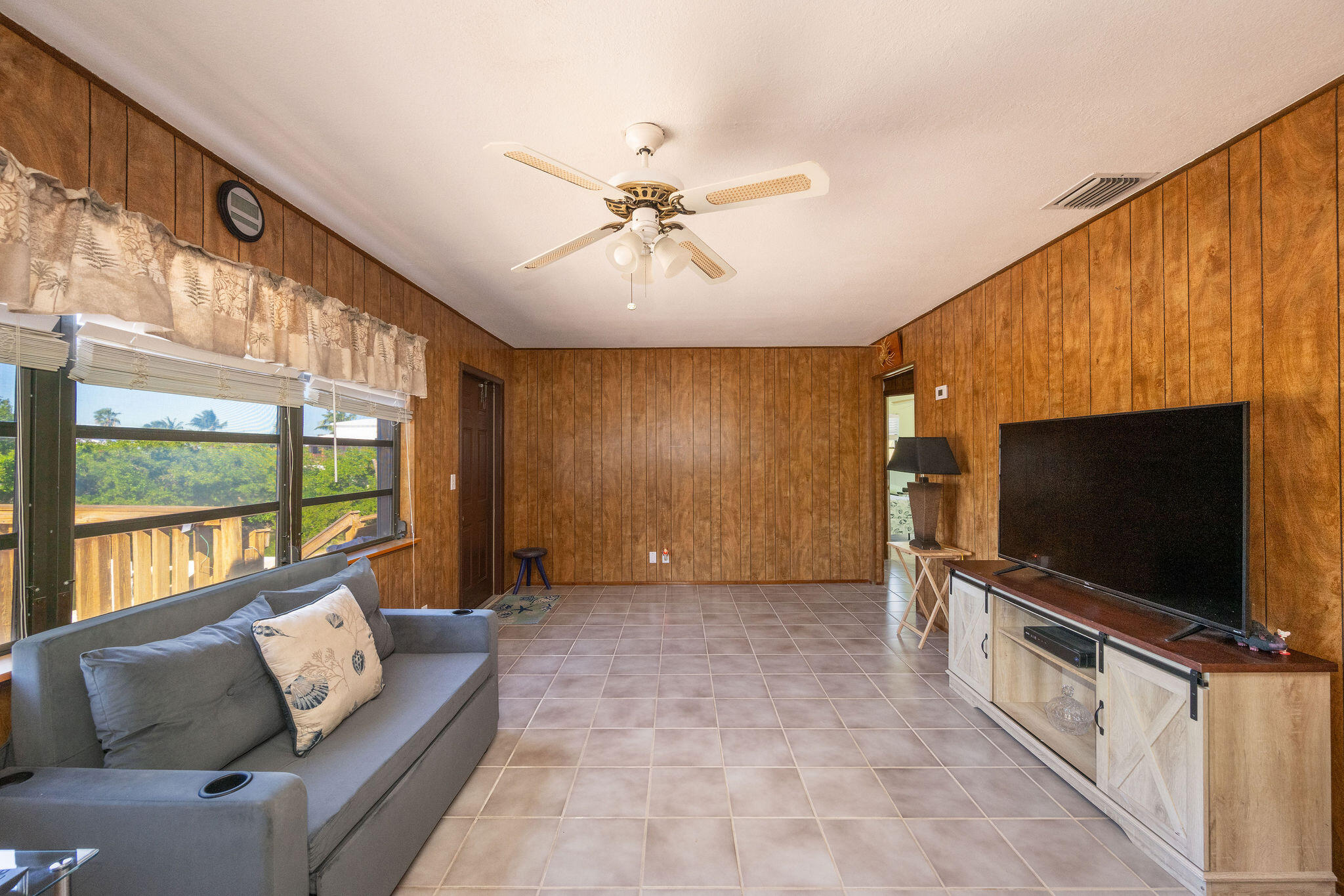 3856 Donna Road Big Pine Key, FL 33043 - Photo 8 of 28 a living room with furniture and a flat screen tv