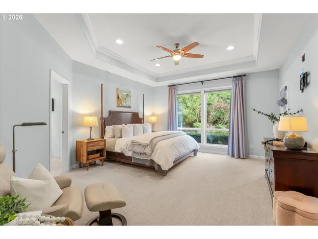 a bedroom with a bed couch and window