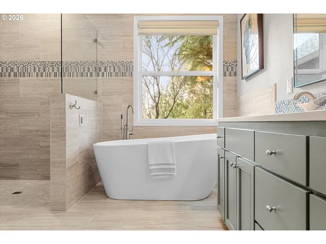 a view of a bathroom with mirror