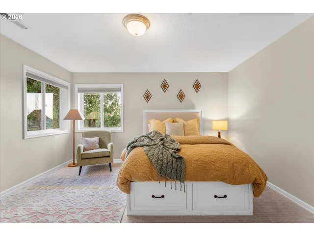 a bedroom with a bed and window