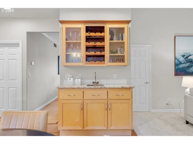 a kitchen with a sink cabinets and window