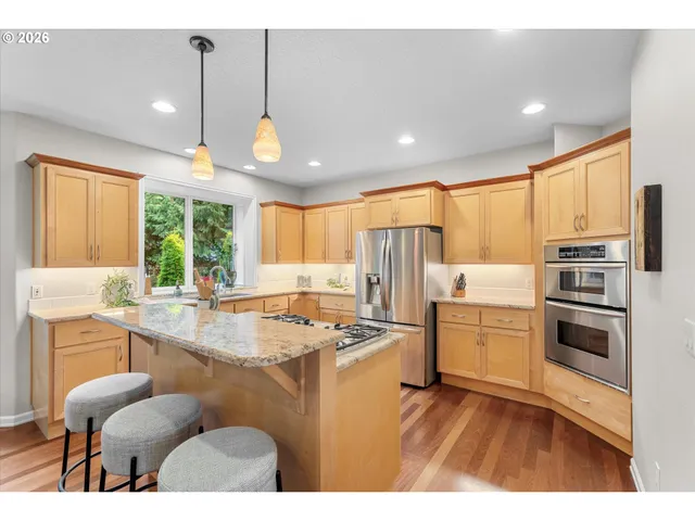 a kitchen with refrigerator cabinets and furniture