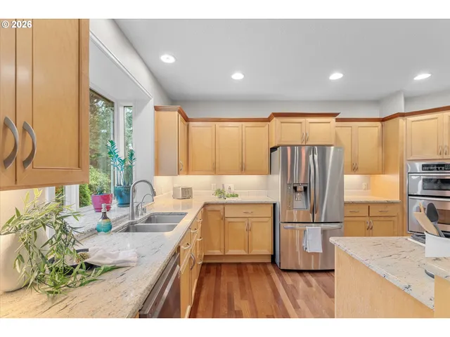 a kitchen with a refrigerator and a sink
