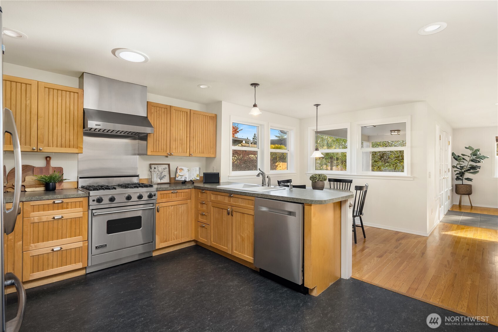 5230 242nd Street Southwest Mountlake Terrace, WA 98043 - Photo 15 of 39 a kitchen with stainless steel appliances granite countertop a stove and a sink
