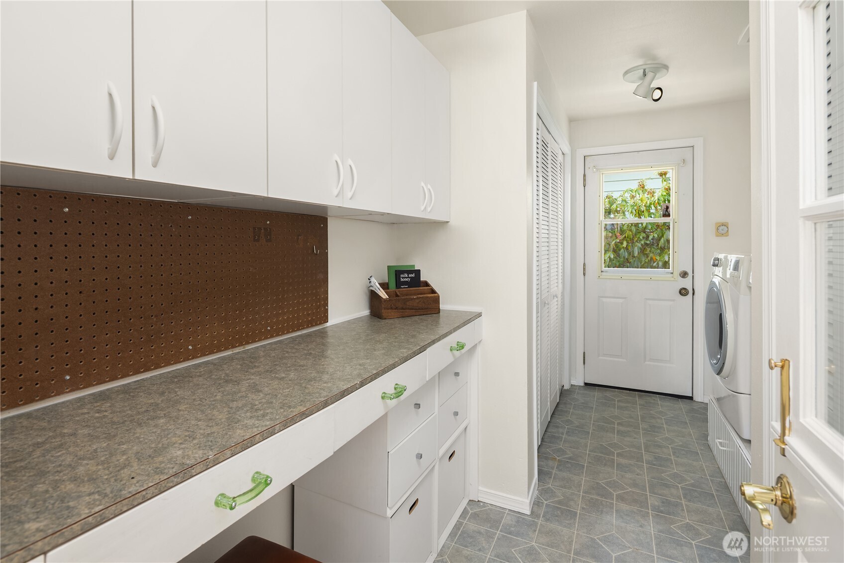 5230 242nd Street Southwest Mountlake Terrace, WA 98043 - Photo 37 of 39 a hallway with cabinets washer and dryer