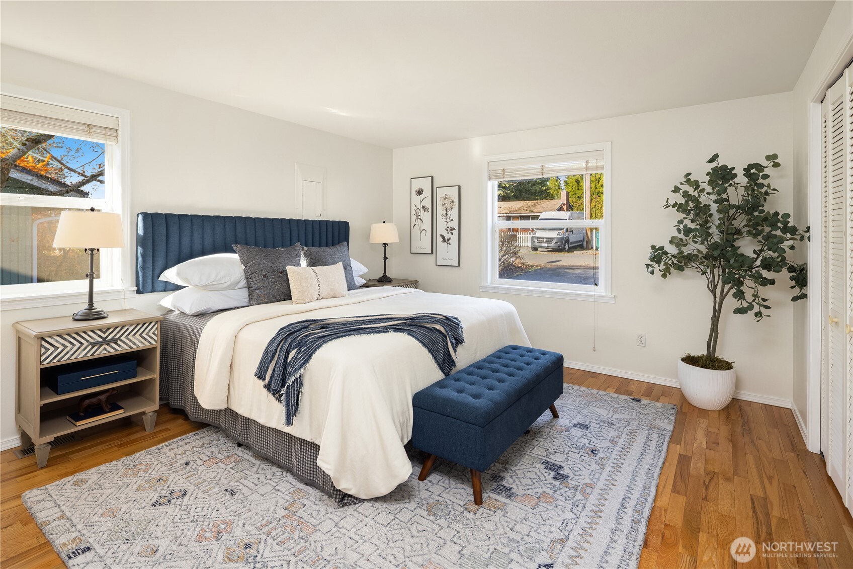 5230 242nd Street Southwest Mountlake Terrace, WA 98043 - Photo 6 of 39 a bedroom with a bed and a potted plant