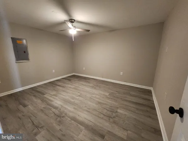 a bathroom with a tub a sink and toilet