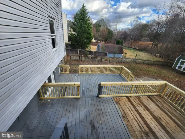 a view of deck with wooden floor and seating space