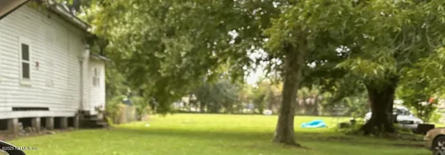 a view of swimming pool from a yard