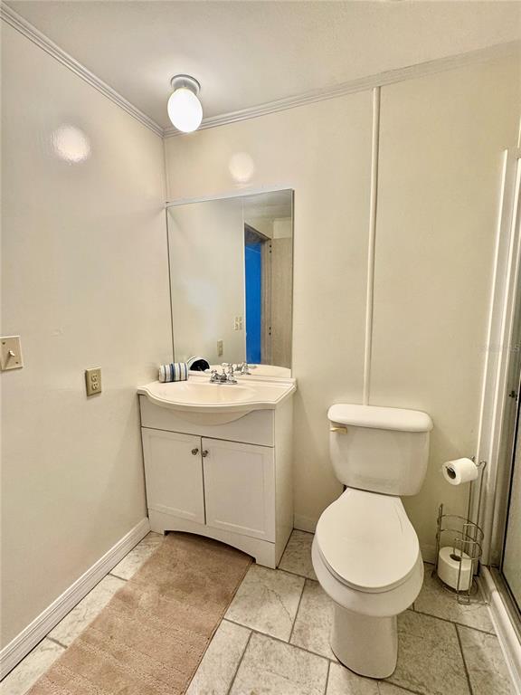 340 Peace Manor Palmetto, FL 34221 - Photo 20 of 38 a bathroom with a toilet sink and mirror