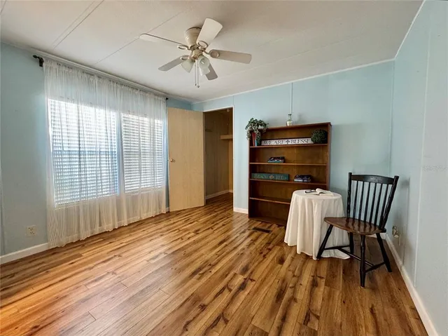 a view of a livingroom with furniture and wooden floor