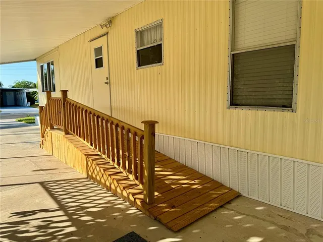 a view of a balcony with wooden floor
