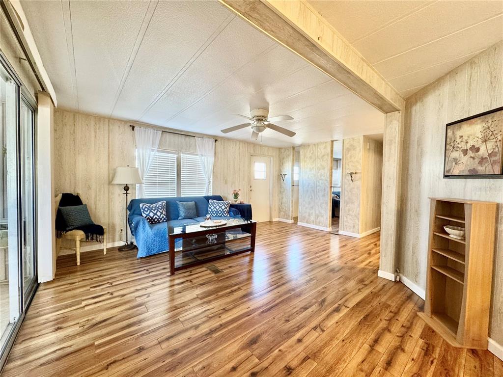 340 Peace Manor Palmetto, FL 34221 - Photo 5 of 38 a living room with furniture and a wooden floor