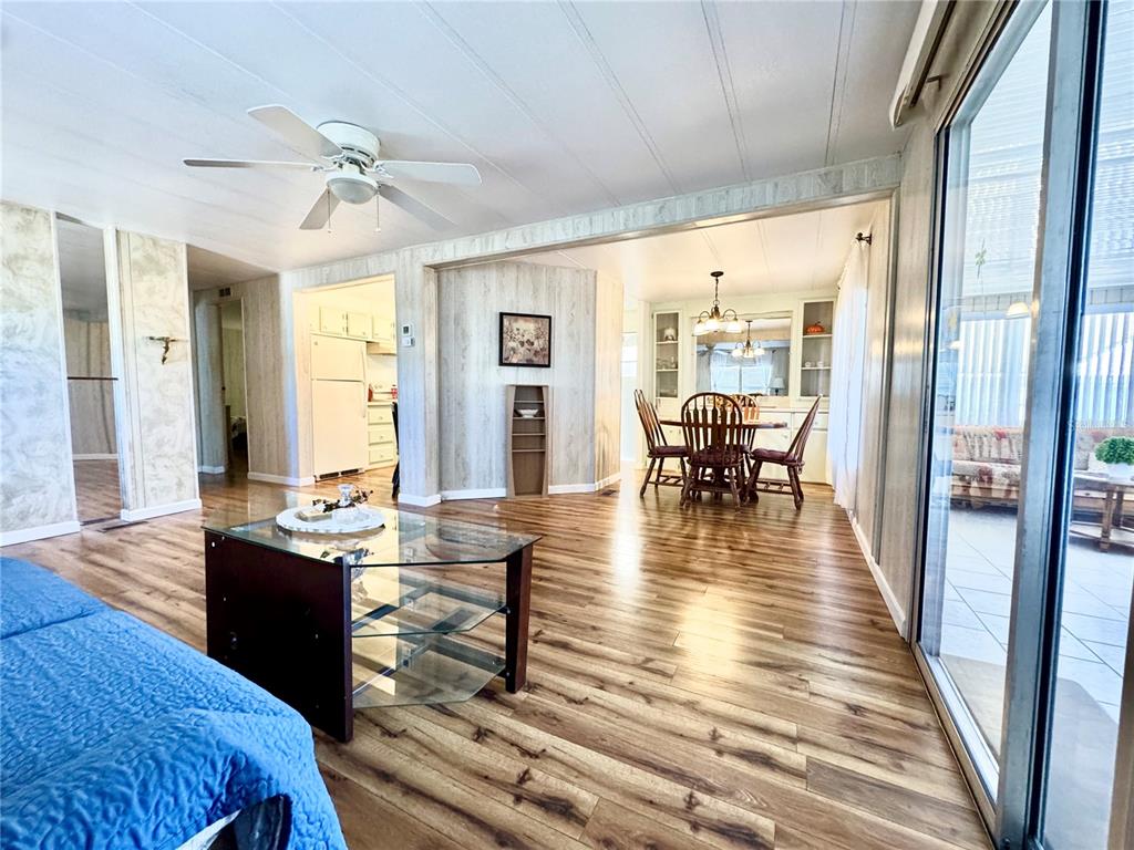 340 Peace Manor Palmetto, FL 34221 - Photo 6 of 38 a view of a dining room with furniture window and wooden floor
