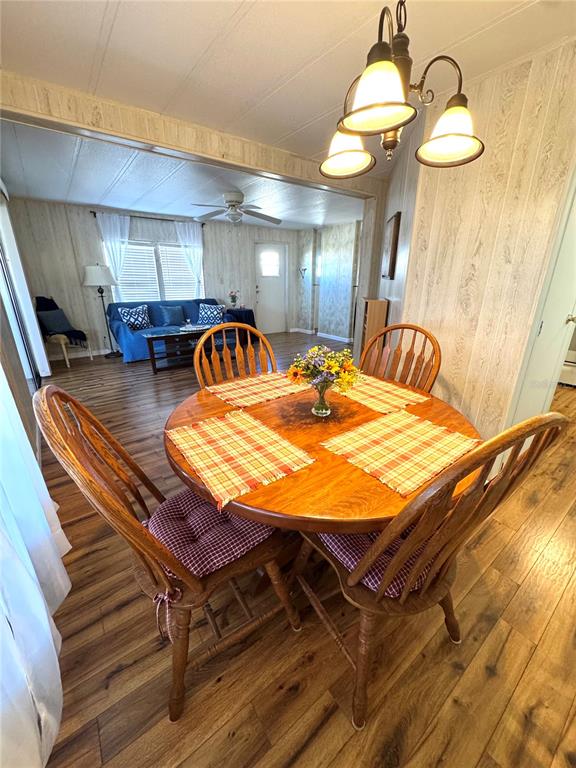 340 Peace Manor Palmetto, FL 34221 - Photo 7 of 38 a dining room with a table and chairs