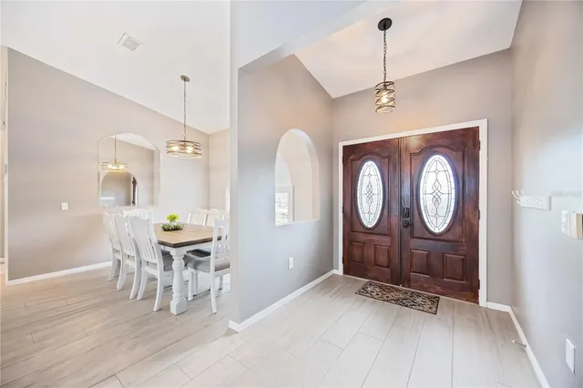 a view of dining area with furniture window and wooden floor