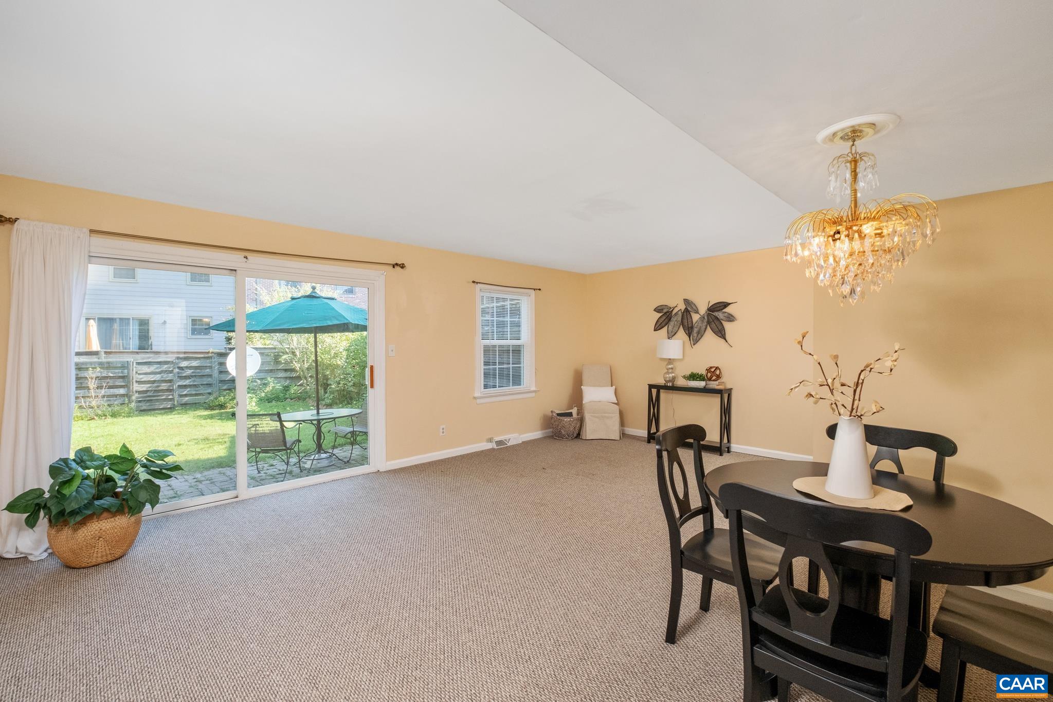 114 Georgetown Green Charlottesville, VA 22901 - Photo 16 of 44 a view of a dining room with furniture window and outside view