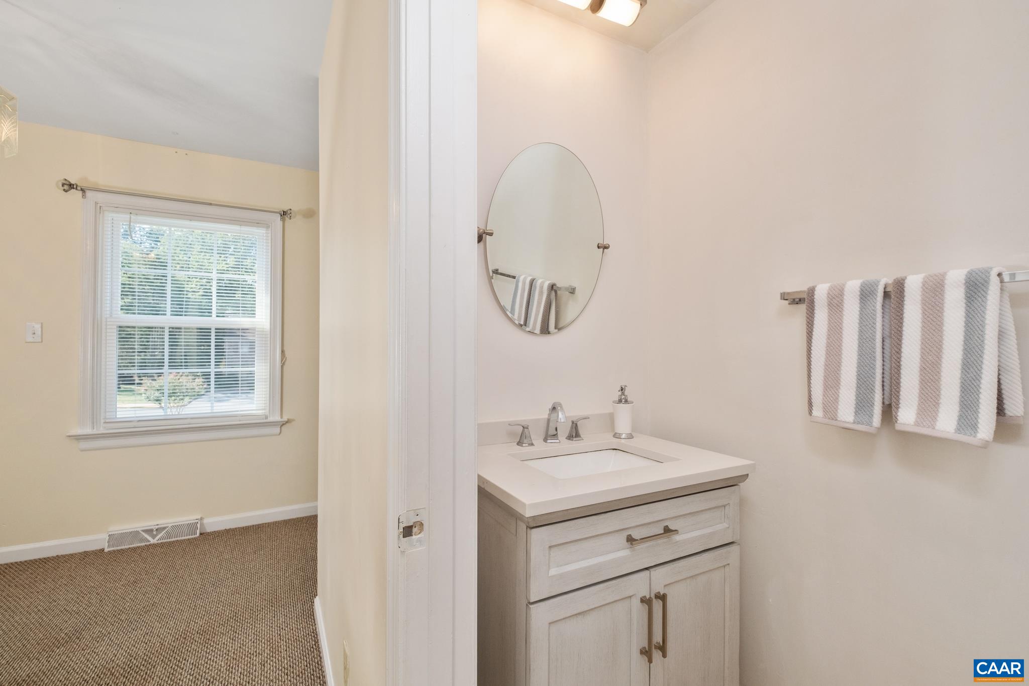 114 Georgetown Green Charlottesville, VA 22901 - Photo 18 of 44 a bathroom with a sink vanity and a mirror