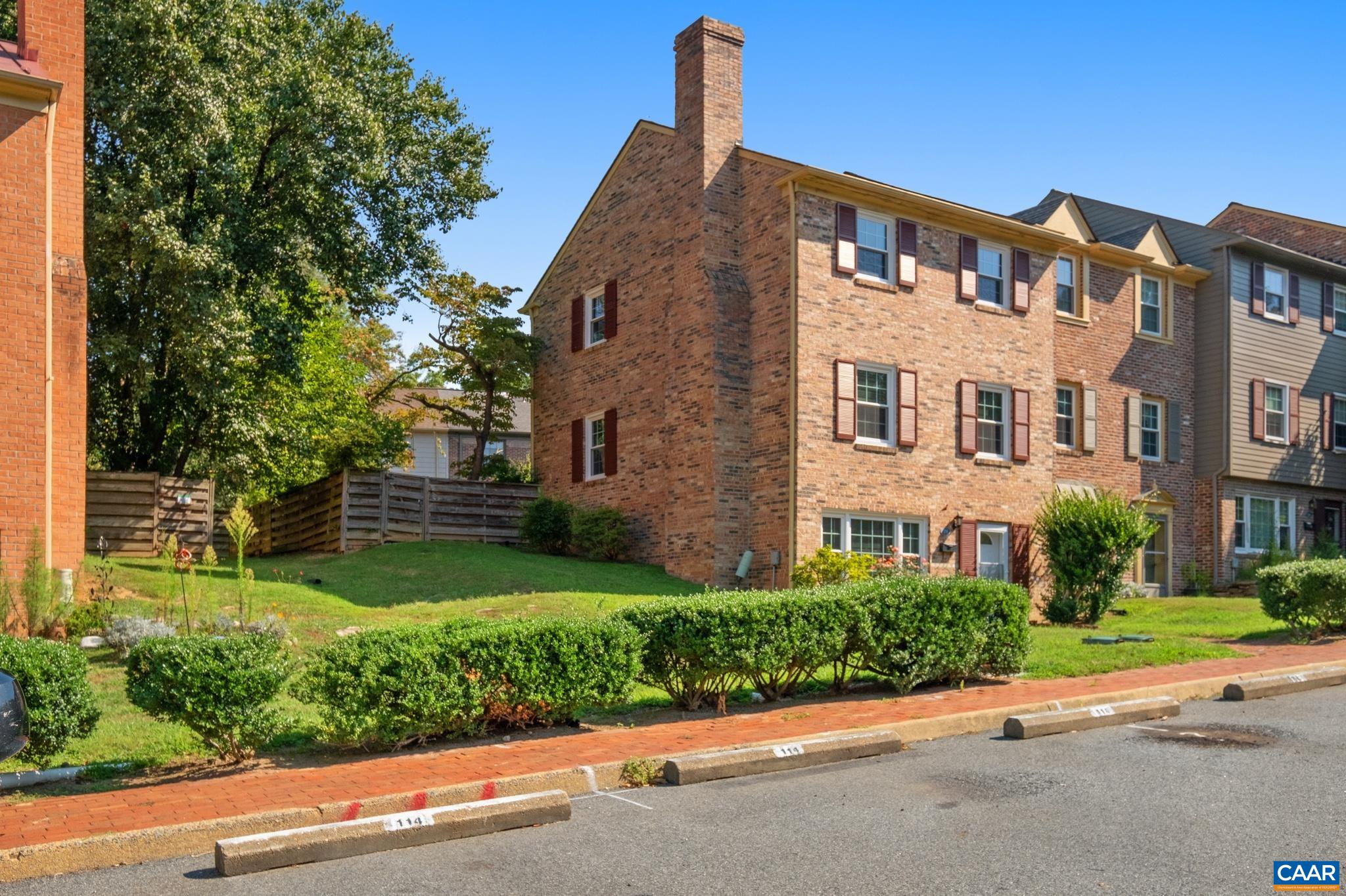 114 Georgetown Green Charlottesville, VA 22901 - Photo 2 of 44 a front view of a house with a yard