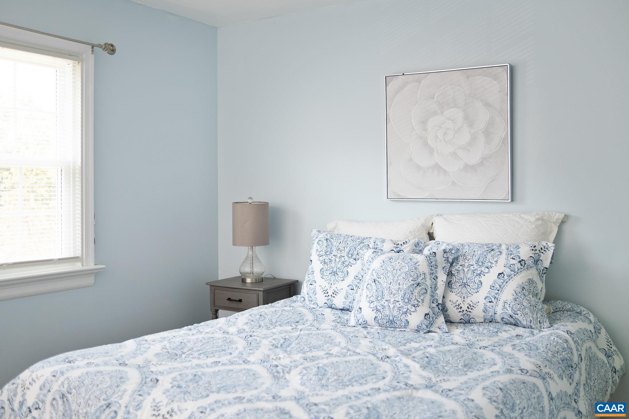 114 Georgetown Green Charlottesville, VA 22901 - Photo 23 of 44 a large bed sitting in a bedroom next to a window