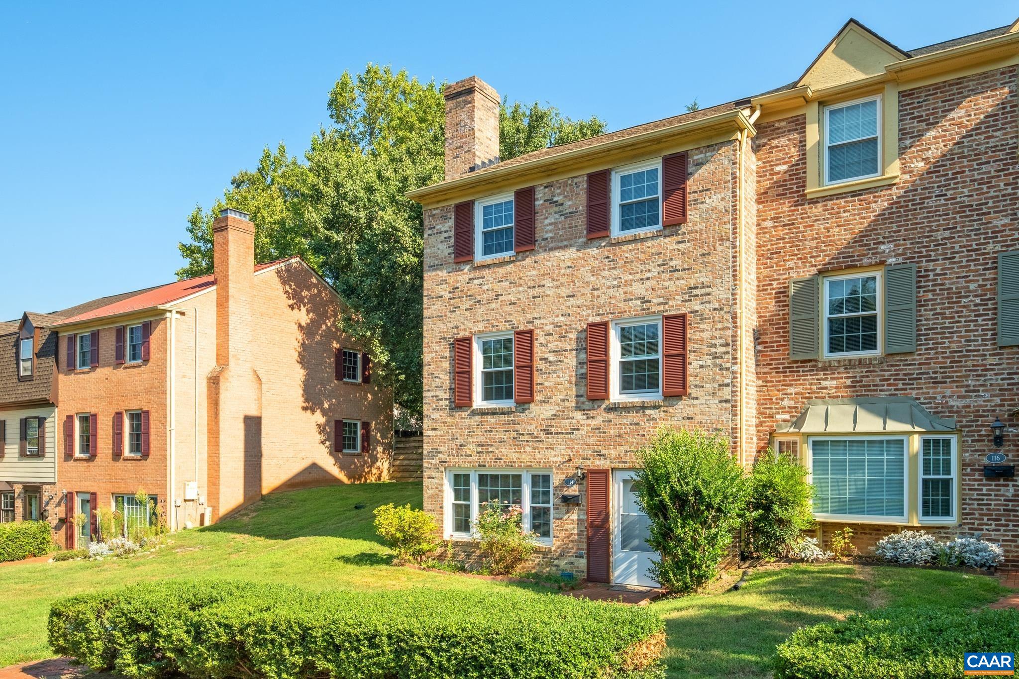 114 Georgetown Green Charlottesville, VA 22901 - Photo 40 of 44 a view of a brick house with a yard and plants