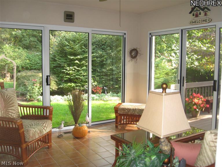 5313 Swepstone Street Northwest Canton, OH 44708 - Photo 13 of 25 Beautiful sun room with ceramic tile floor overlooks this lovely lot