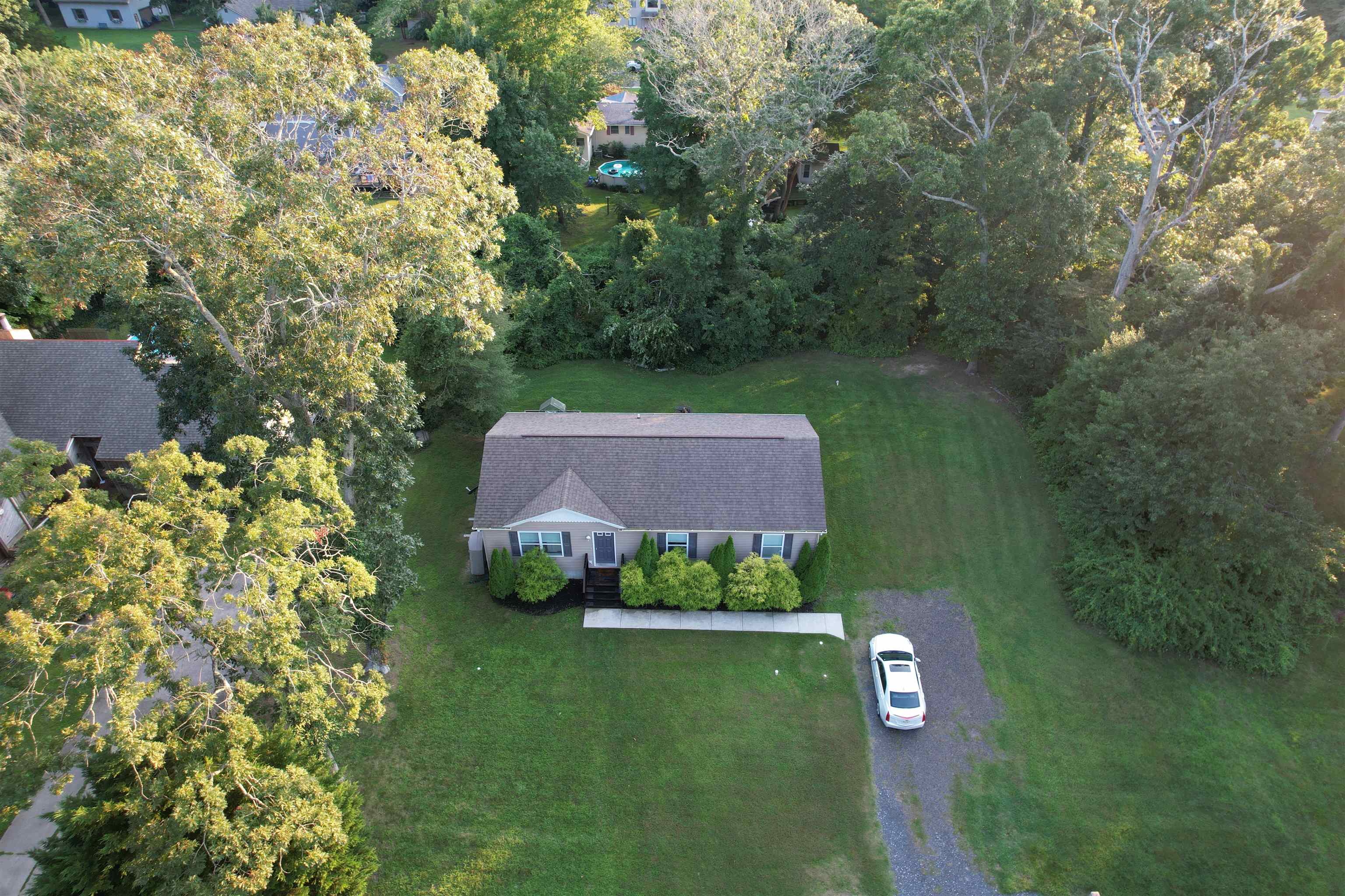 972 Tecumseh Road Erma, NJ 08204 - Photo 2 of 30 a view of a garden with a building in front of it