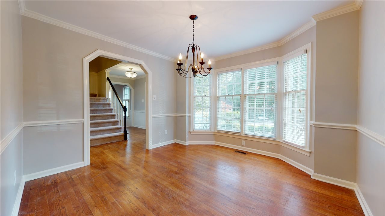 2604 Cobworth Court Raleigh, NC 27613 - Photo 10 of 30 The dining room is bathed in natural light and boasts custom hardwood flooring