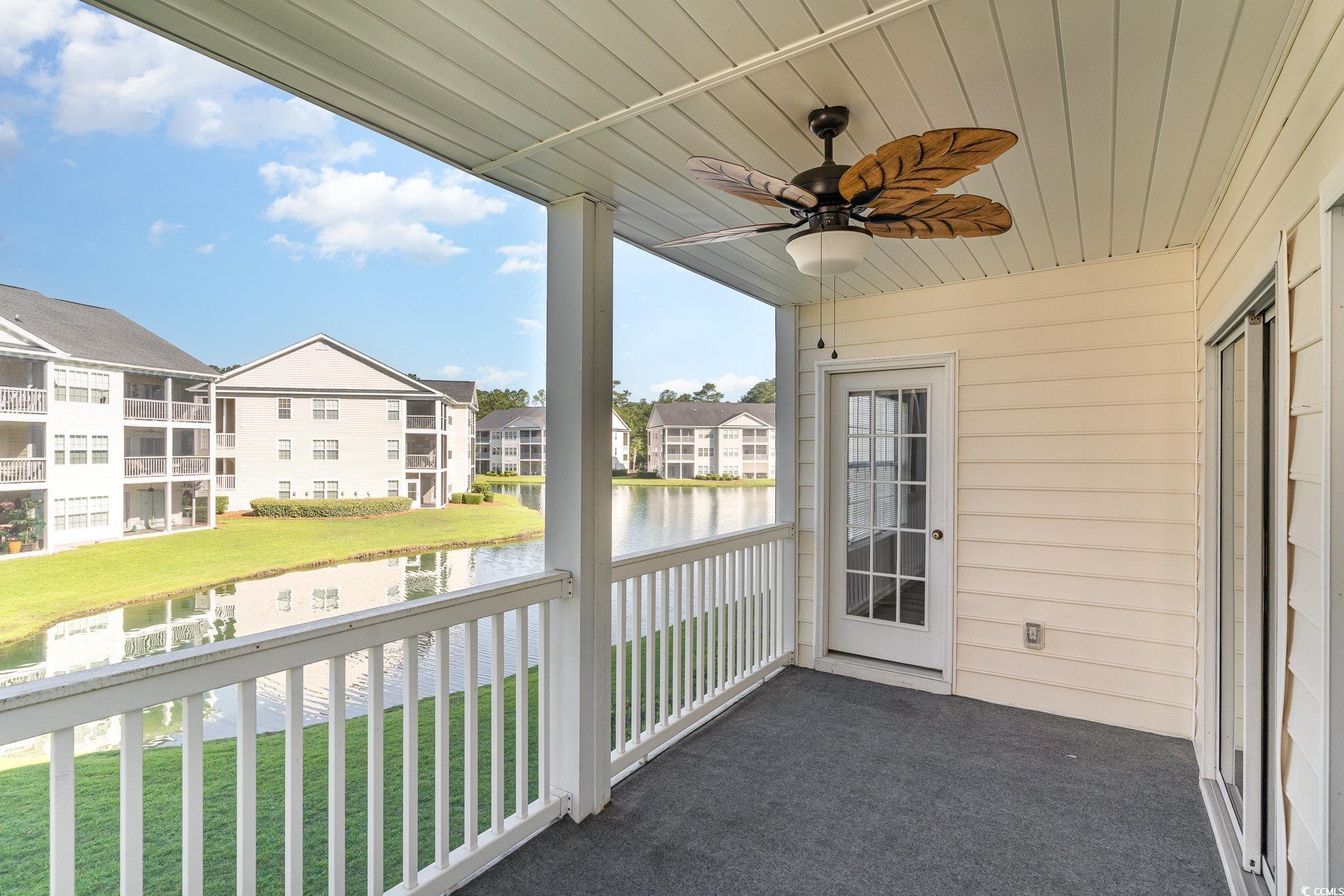 651 Woodmoor Drive, Unit 201 Murrells Inlet, SC 29576 - Photo 25 of 35 Balcony featuring a water view and ceiling fan