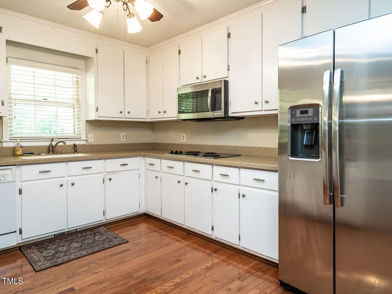 6600 Barbee Road Durham, NC 27713 - Photo 12 of 33 a kitchen with stainless steel appliances granite countertop a refrigerator sink and cabinets