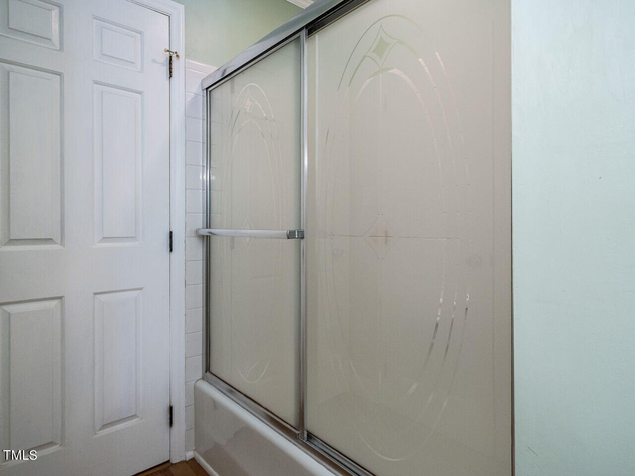 6600 Barbee Road Durham, NC 27713 - Photo 20 of 33 a bathroom with a glass shower door